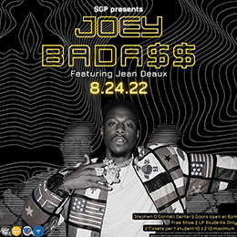 Poster with portrait of a man wearing a patterned jacket and jewelry. Yellow text above and below.